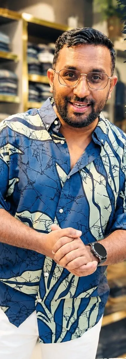 Navy and sage printed box fit shirt worn with white trousers