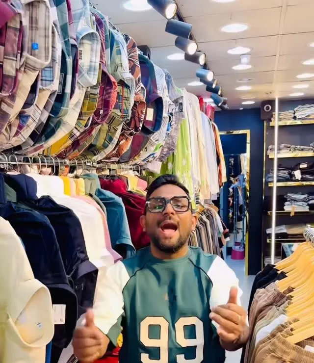 Rails of check shirts inside the Trendz store